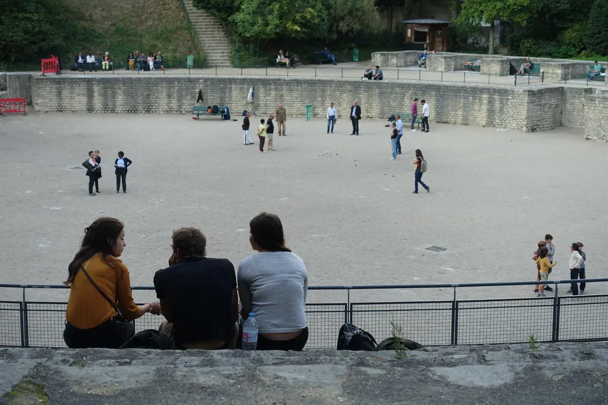The Lutetia arena, tiers and sand floor beneath the trees, in the 5th arrondissement