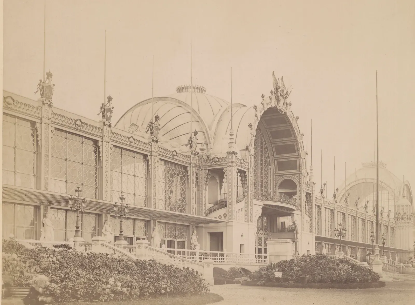 Photograph by Delmaet and Durandelle: the façade of the Palais du Champ-de-Mars at the 1878 World's Fair, with its great glass bays and statues