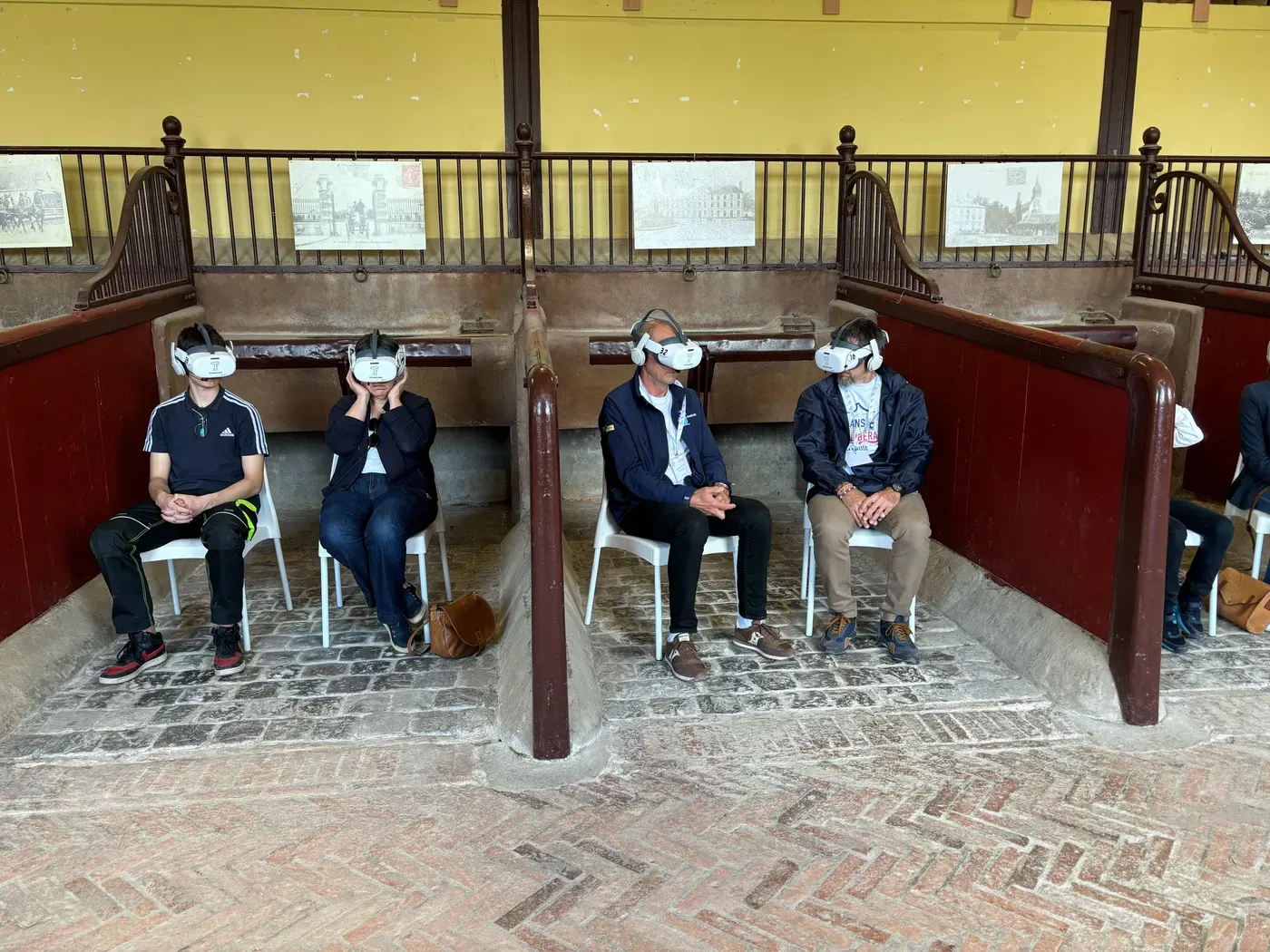 Visitors wearing virtual-reality headsets during the national tribute at the Saint-Lô stud farm